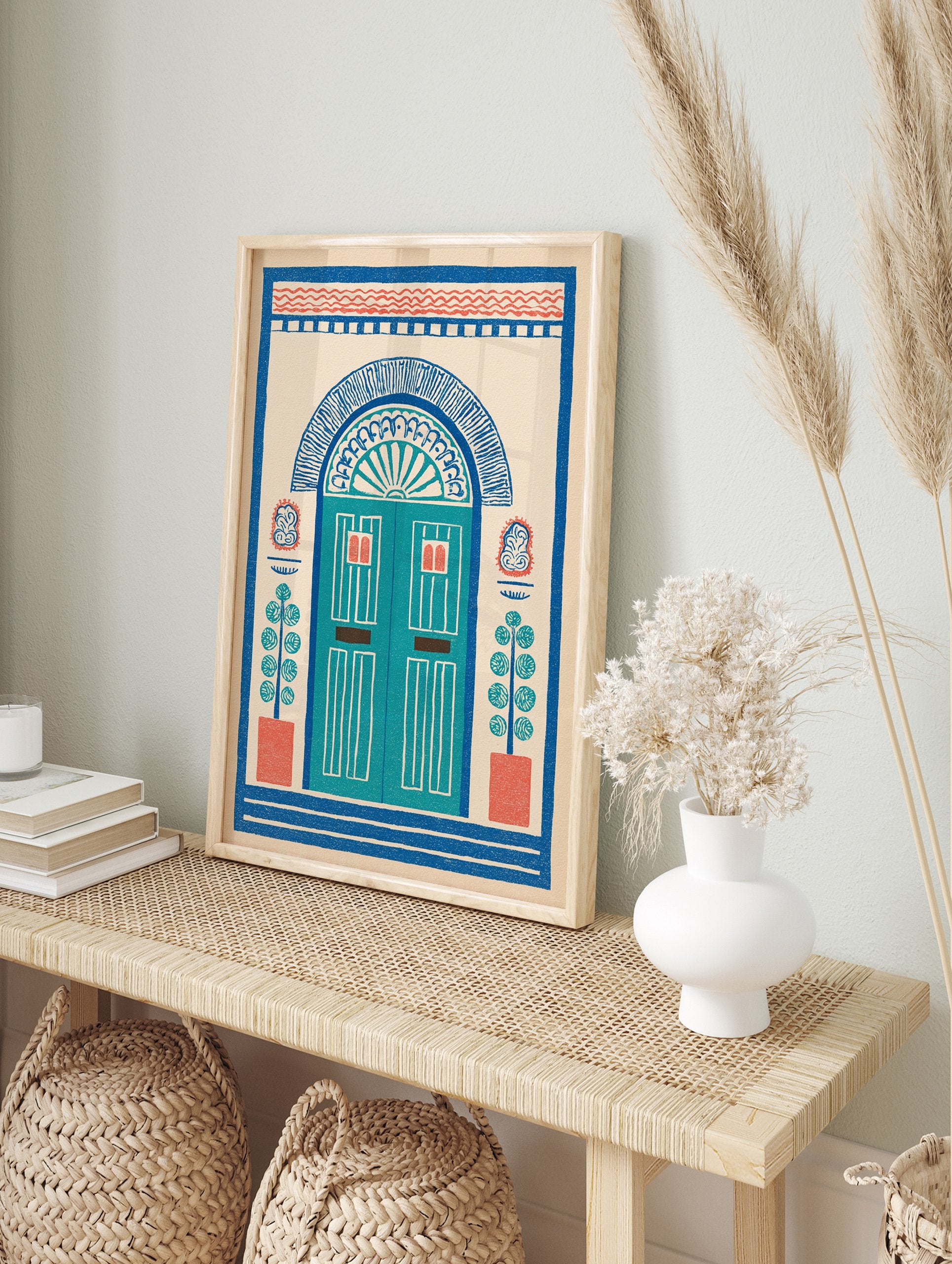 Illustrative doorway wall art print with an arched blue door, red accents, and potted plants on a cream background, folk art style. - Image 3