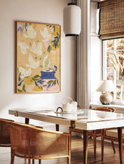 Illustrative art print with white doves flying around a blue gramophone and music notes on a beige, in a styled room mockup