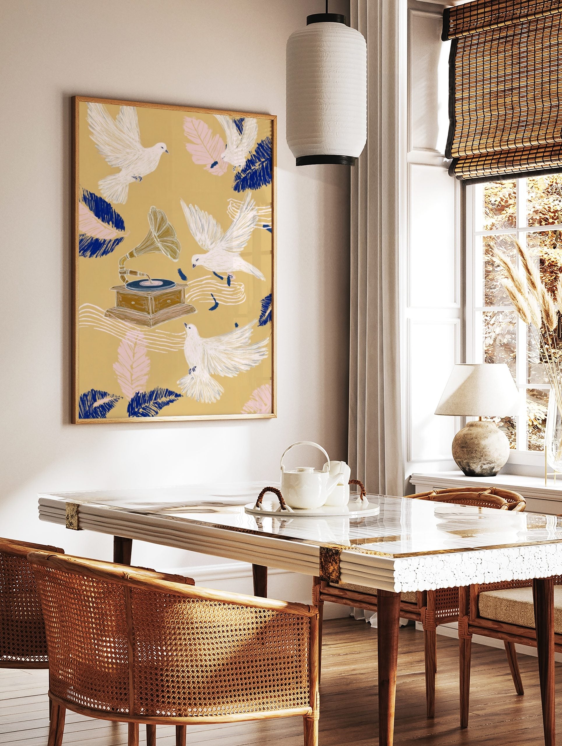 Illustrative art print with white doves flying around a vintage gramophone, blue and pink feathers, in a styled room mockup