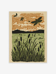 Linocut style art print of dragonflies flying over cattails in a marshland with an orange sky