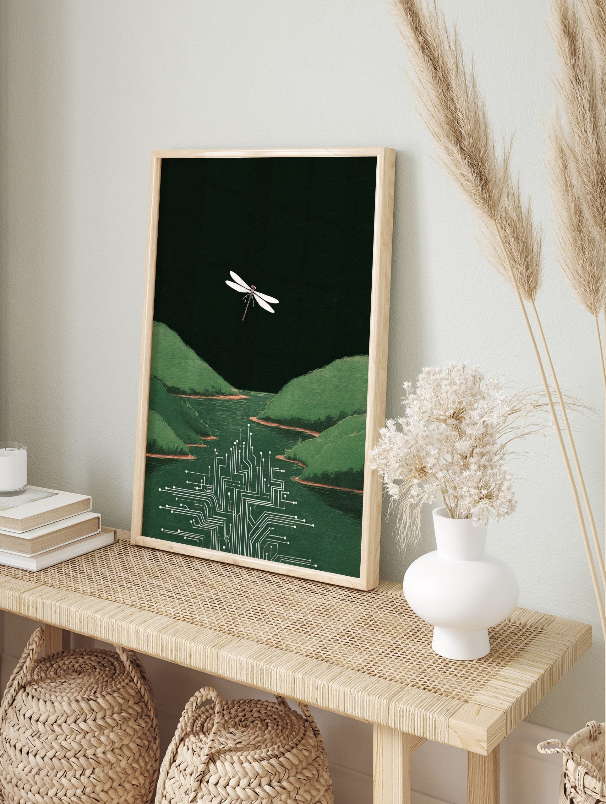 White dragonfly flying above green river merging into a circuit board with green hills and, in an alternate framed mockup