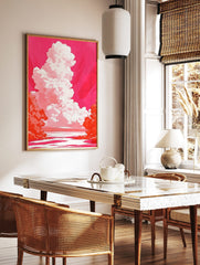 Dramatic towering white and pink cloud against a vibrant magenta sky over water with orange foliage, in a styled room mockup