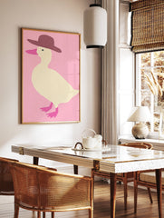 Illustration of a cream duck wearing a brown hat against a pink background, with pink beak and feet. - Image 2