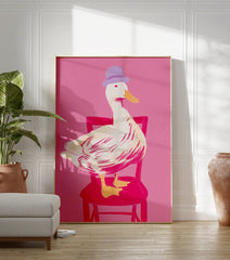 Whimsical duck art print with a white duck in a purple hat sitting on a pink chair against a bright pink background - Image 3
