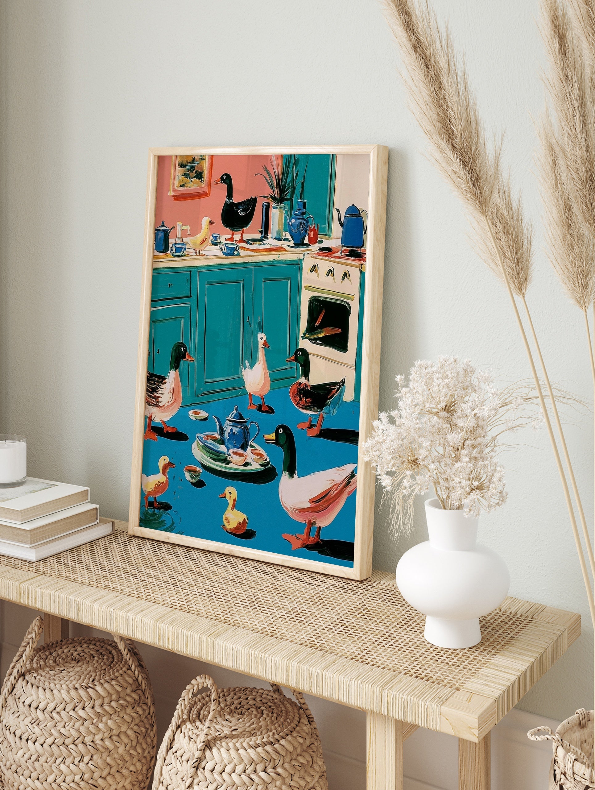 Whimsical illustration of ducks and ducklings in a colourful kitchen with a teapot and stove, in an alternate framed mockup