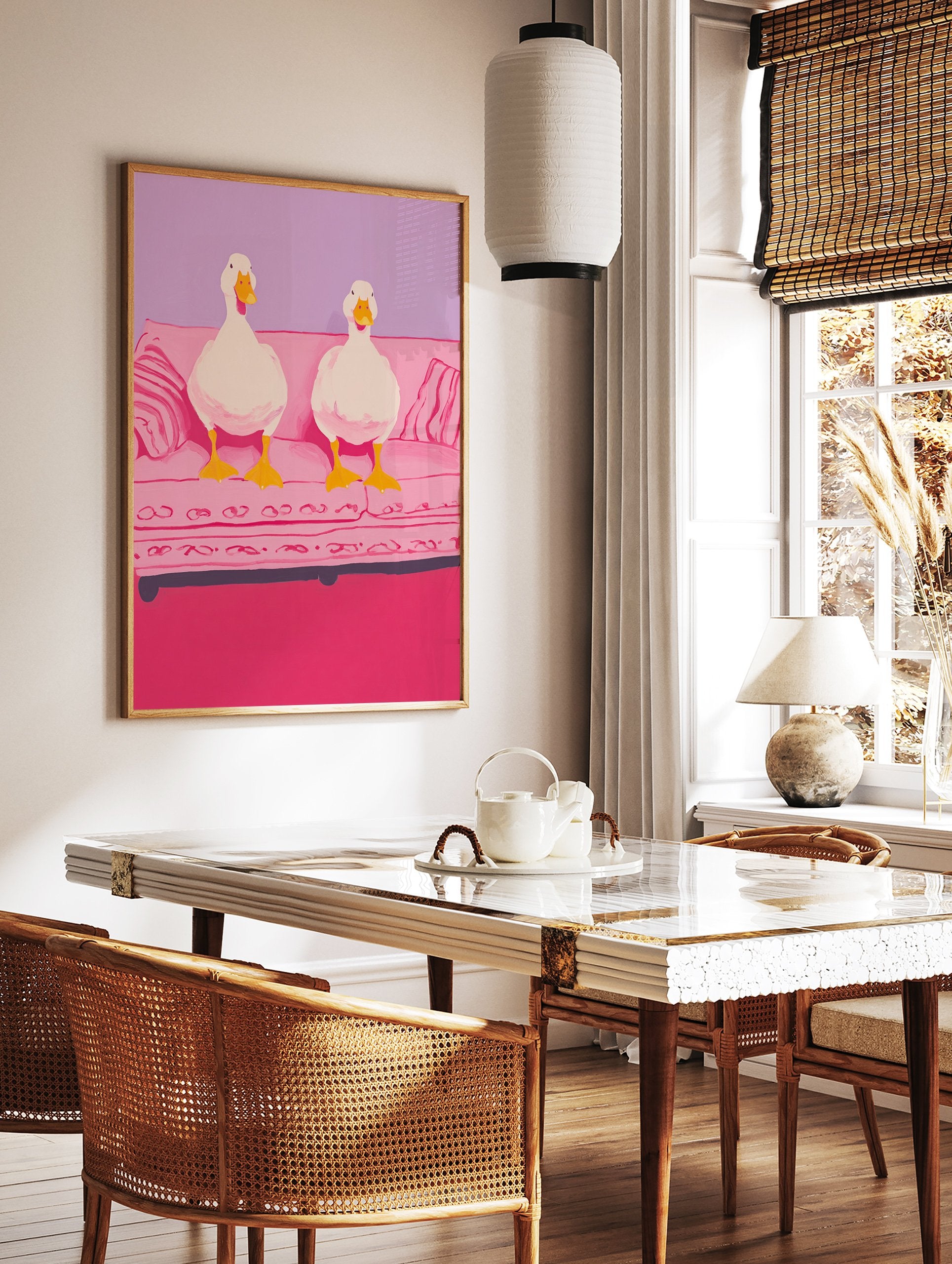 Whimsical illustration of two white ducks with yellow beaks and feet sitting on a pink couch against a purple wall. - Image 2