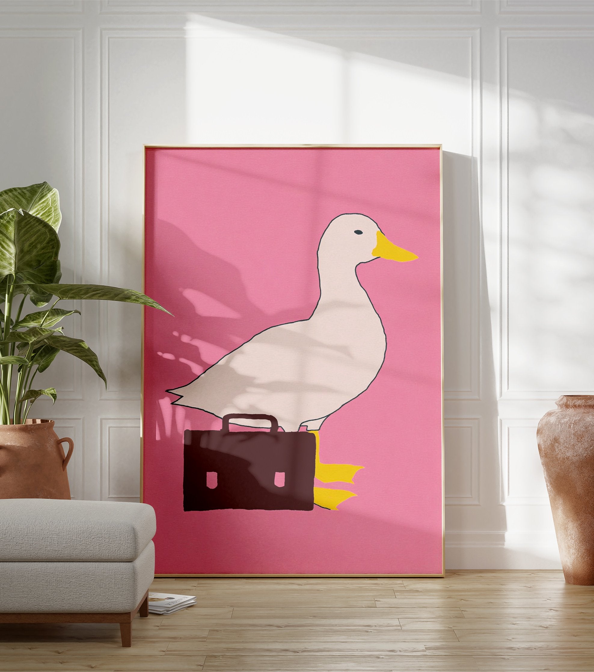 White duck with yellow beak and black eye carrying a brown briefcase on a pink background, quirky duck wall art print. - Image 3