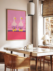 Two white ducks with yellow beaks and feet sitting on a pink and white striped couch in pink room. Duck wall art. - Image 2