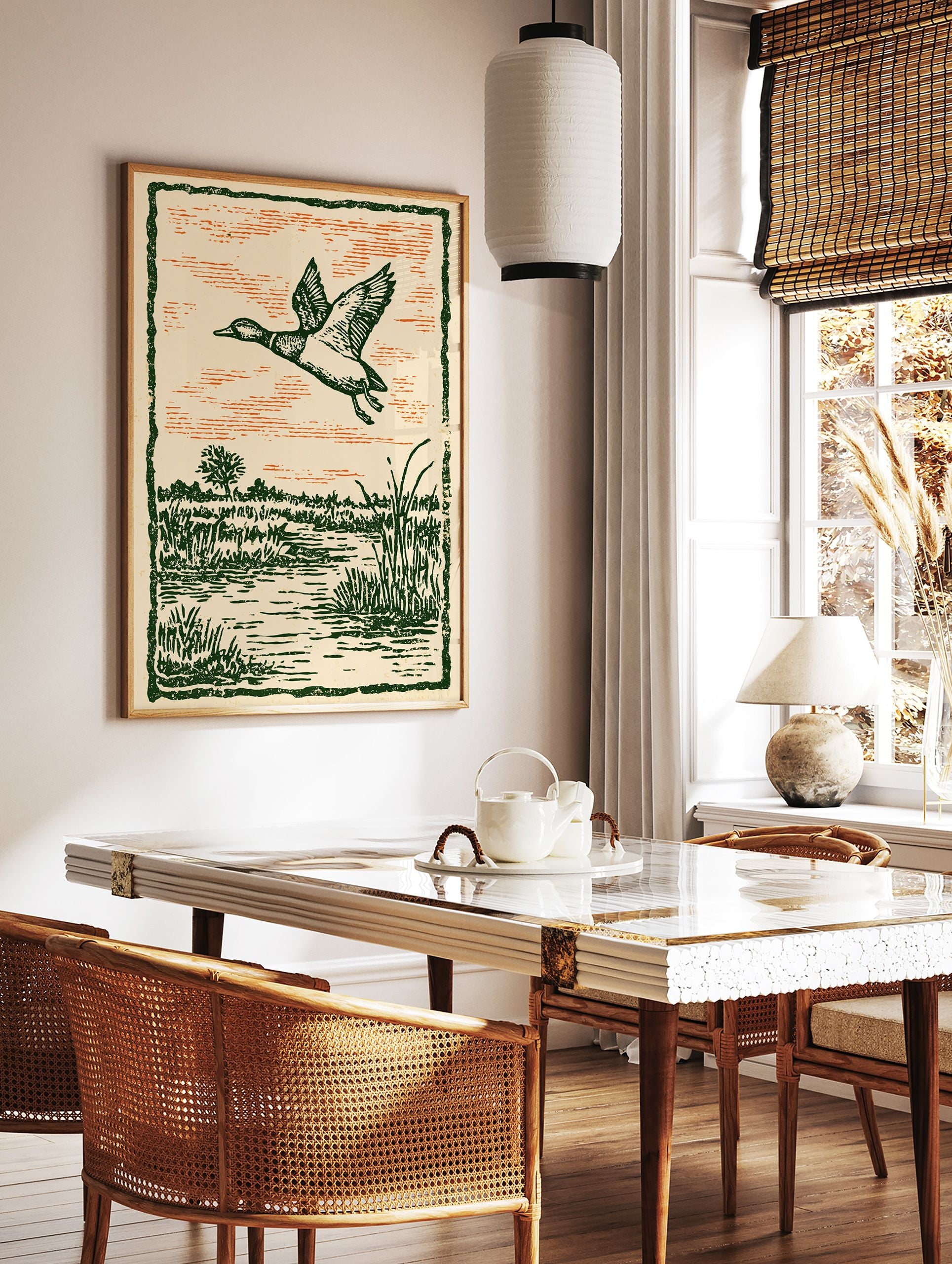 Vintage illustration of a duck flying over a green marshland with an orange sky, framed by a dark green border. - Image 3