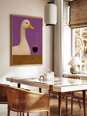 Quirky illustration of a white duck sitting at a wooden table with a glass of red wine against a, in a styled room mockup