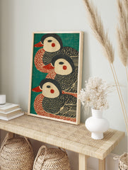 Three stylised duck illustrations with red beaks and cheeks on a teal background, in a, in an alternate framed mockup