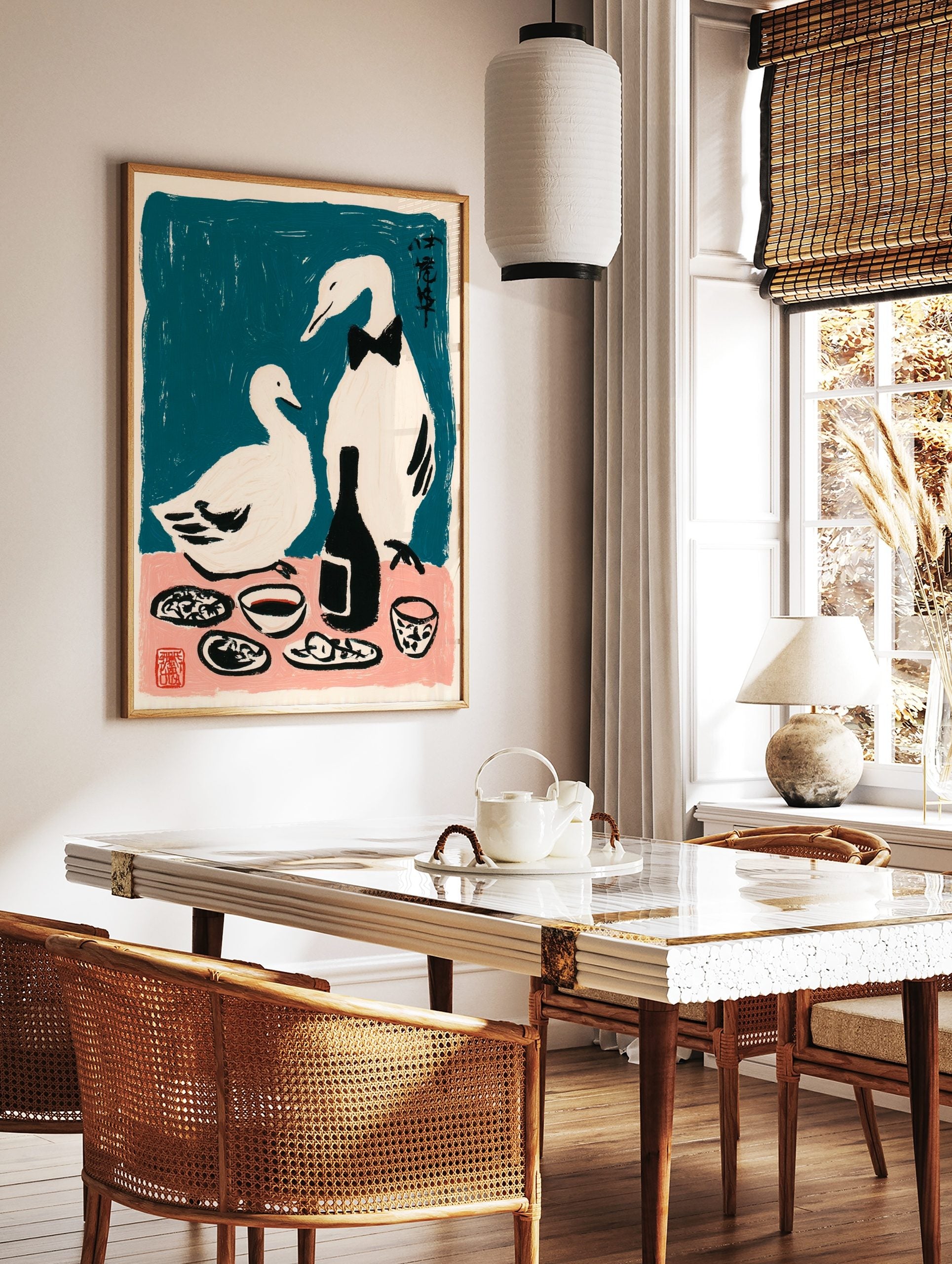 Illustrative print of two white ducks, one in a bow tie, at a dinner table with a bottle against a, in a styled room mockup
