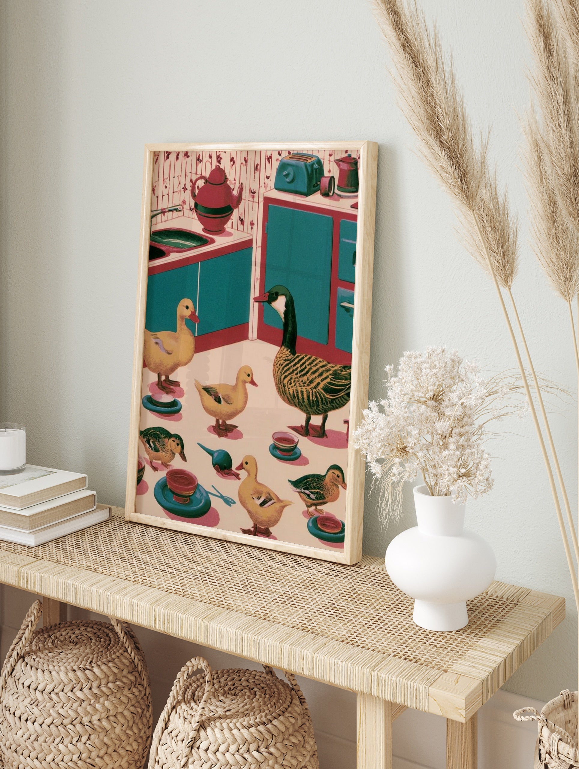 Retro kitchen wall art illustration of ducks and a goose in a teal and red kitchen setting, in an alternate framed mockup