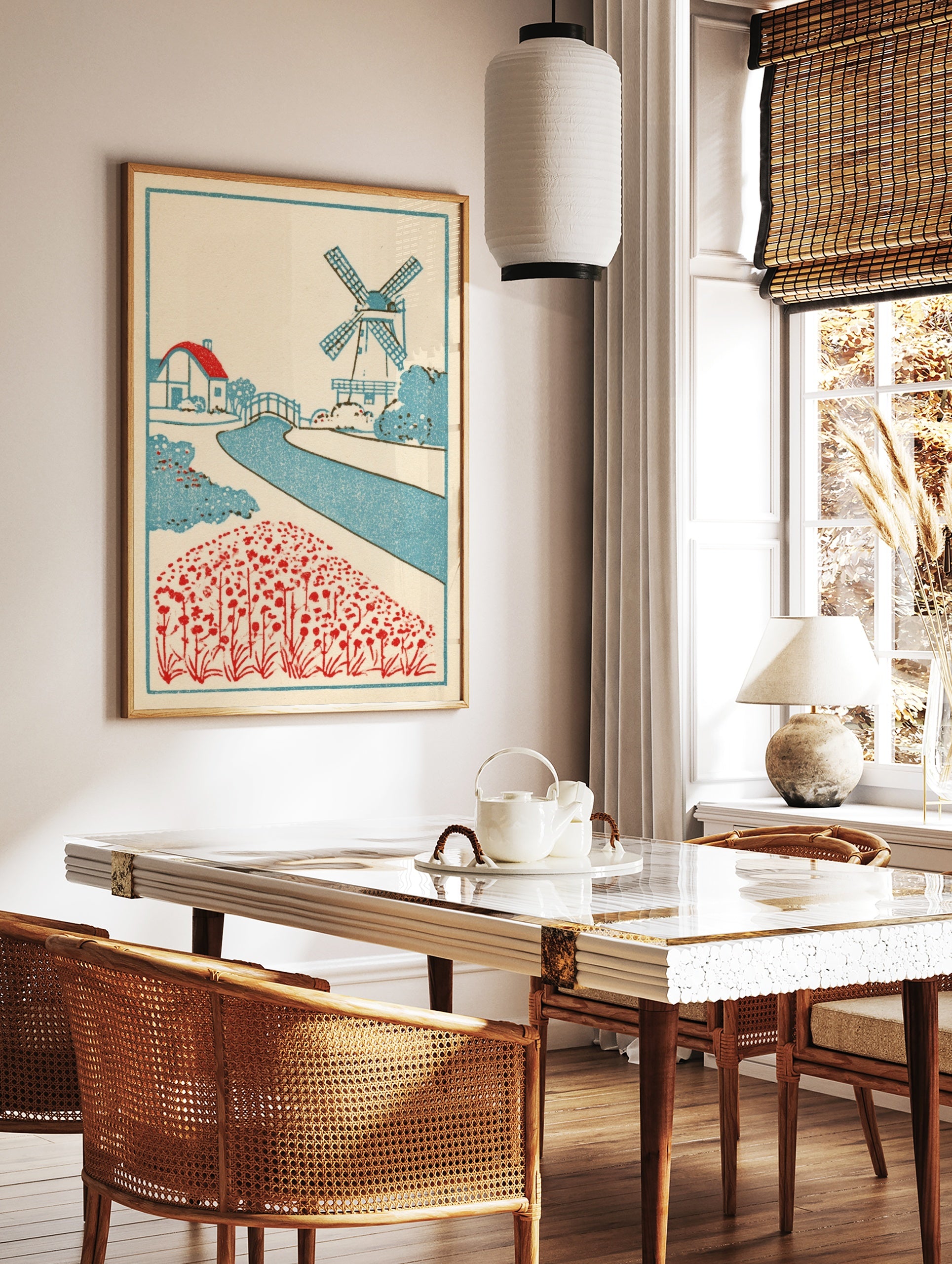 Vintage style Dutch landscape art print with a windmill, cottage, canal, and red flower field on a, in a styled room mockup