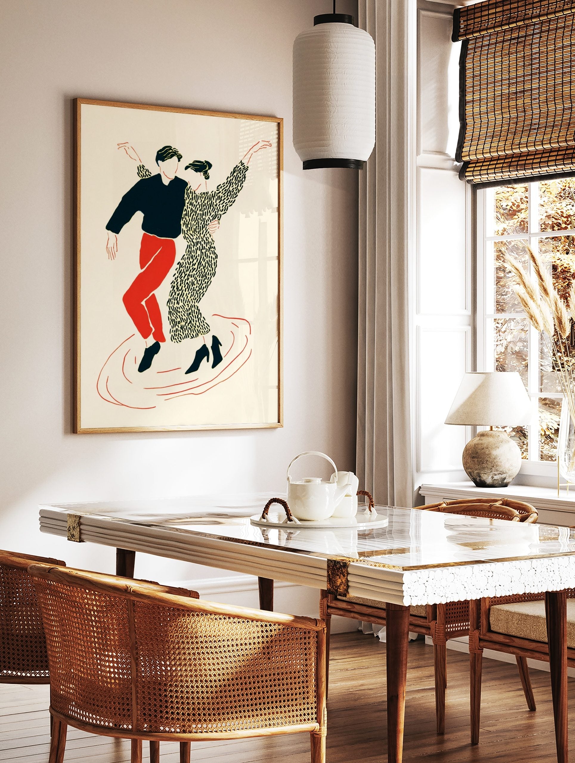 Illustrative print of two dancers in black, red, and cream, in dynamic poses on a plain background, in a styled room mockup
