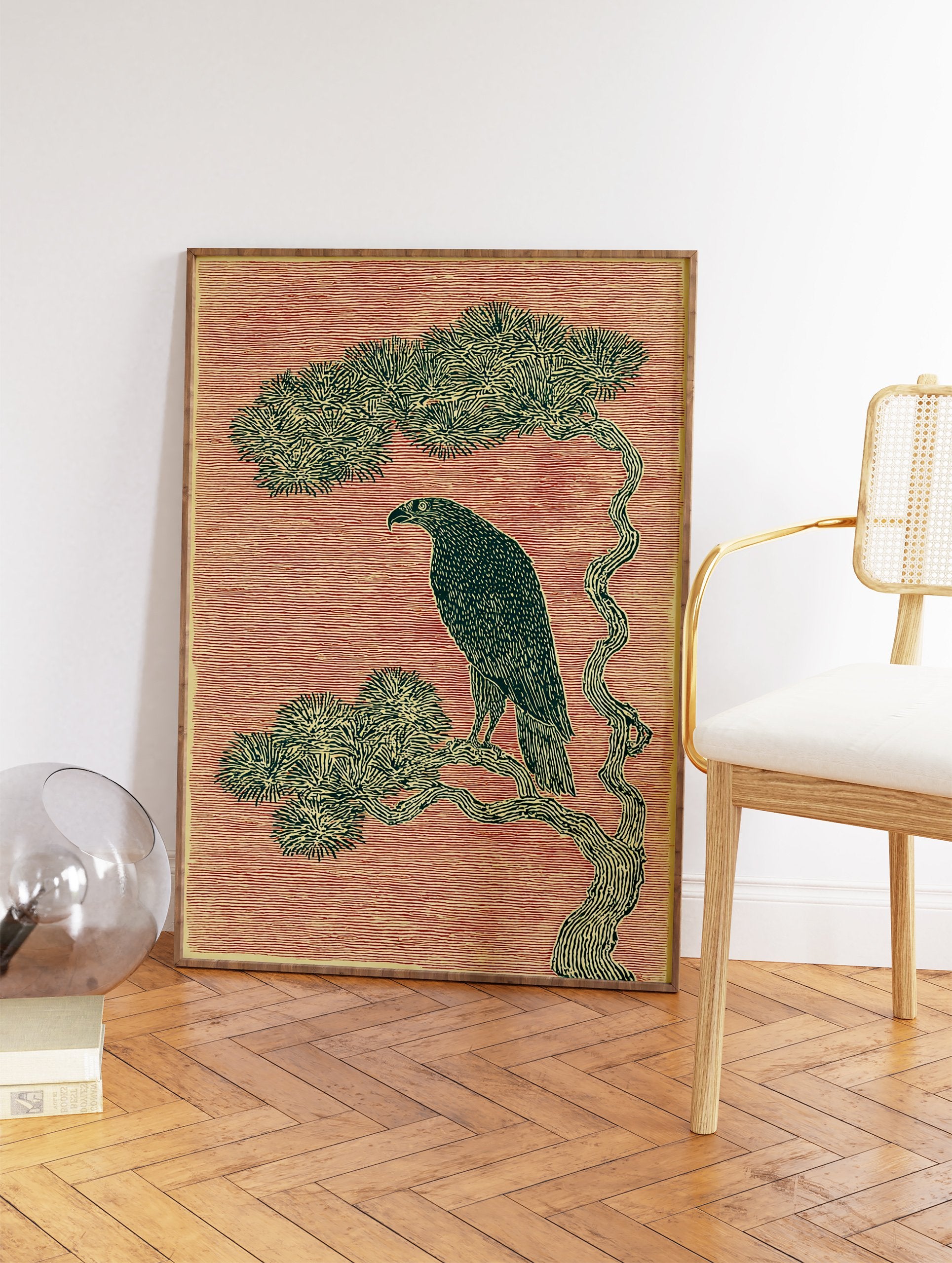 Eagle wall art illustration of a majestic bird perched on a pine tree branch against a red textured background in woodcut style. - Image 2