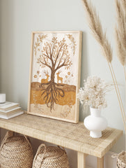 Earthy illustration of a tree with exposed roots, a resting deer, and a standing deer, framed, in an alternate framed mockup