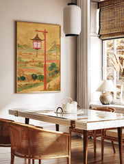 Illustrative East Asian lantern with red post, golden background, green hills, and fields, in a styled room mockup