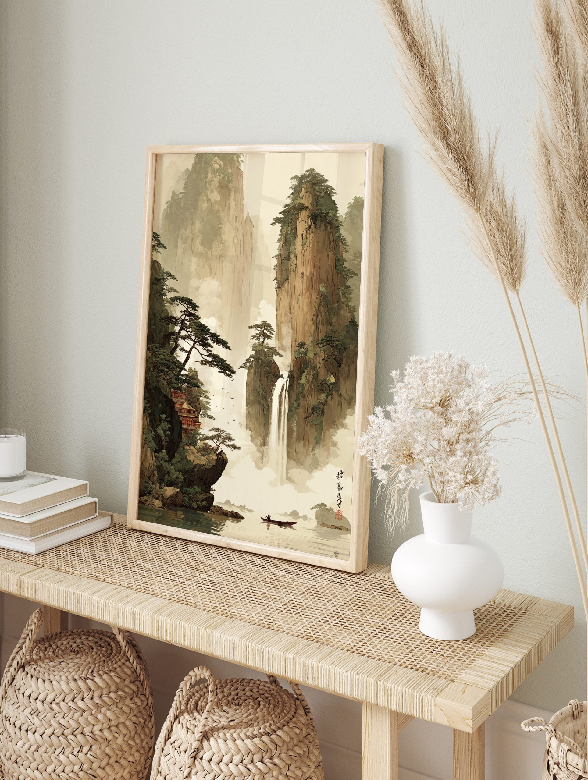 East Asian landscape art with tall mountains, waterfall, red temple, pine trees, and a person, in an alternate framed mockup