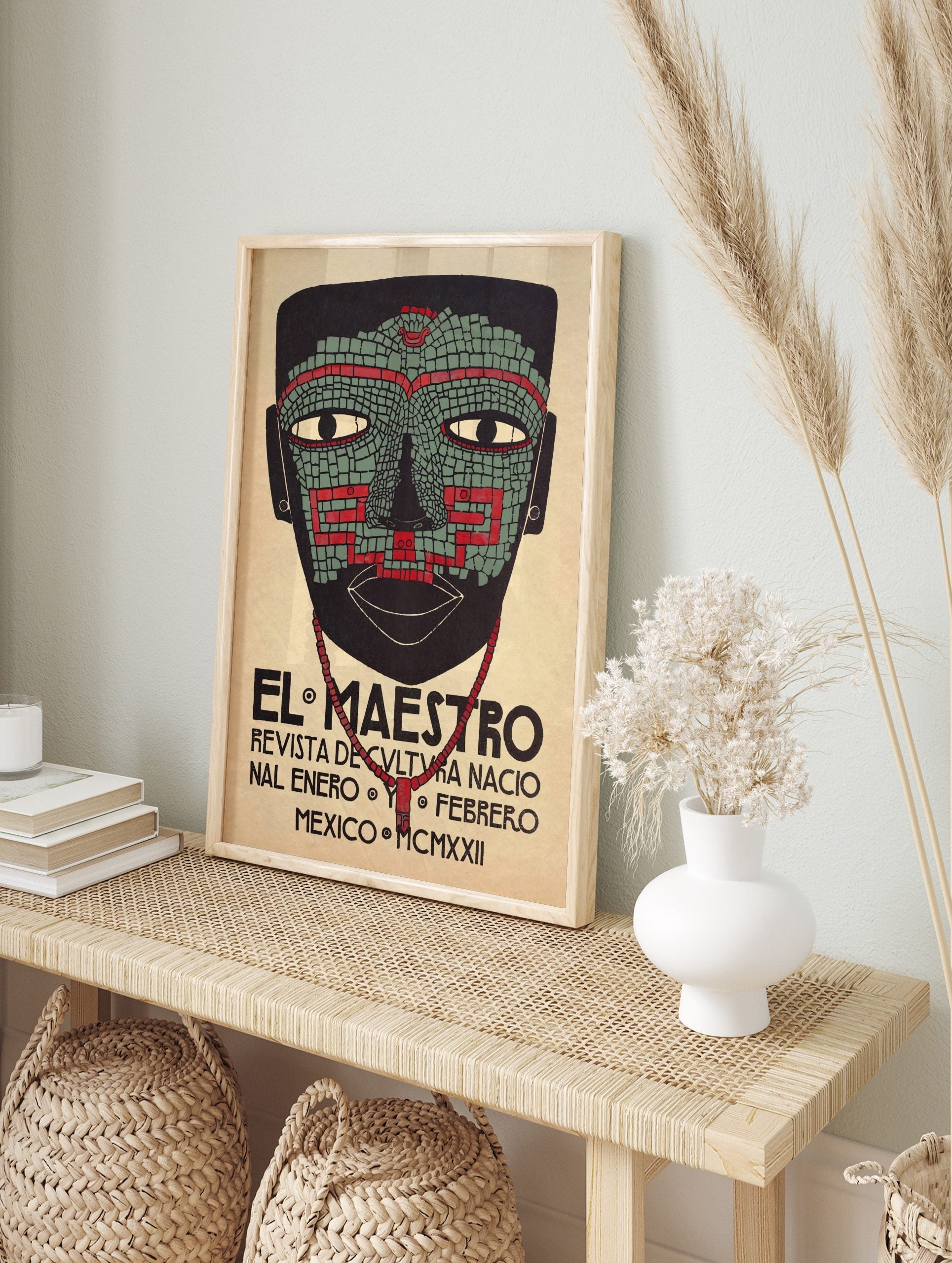 El Maestro Mexican art print with a mosaic-style mask in black, green, and red, and 'MCMXXII' text, in an alternate framed