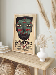 El Maestro Mexican art print with a mosaic-style mask in black, green, and red, and 'MCMXXII' text, in an alternate framed