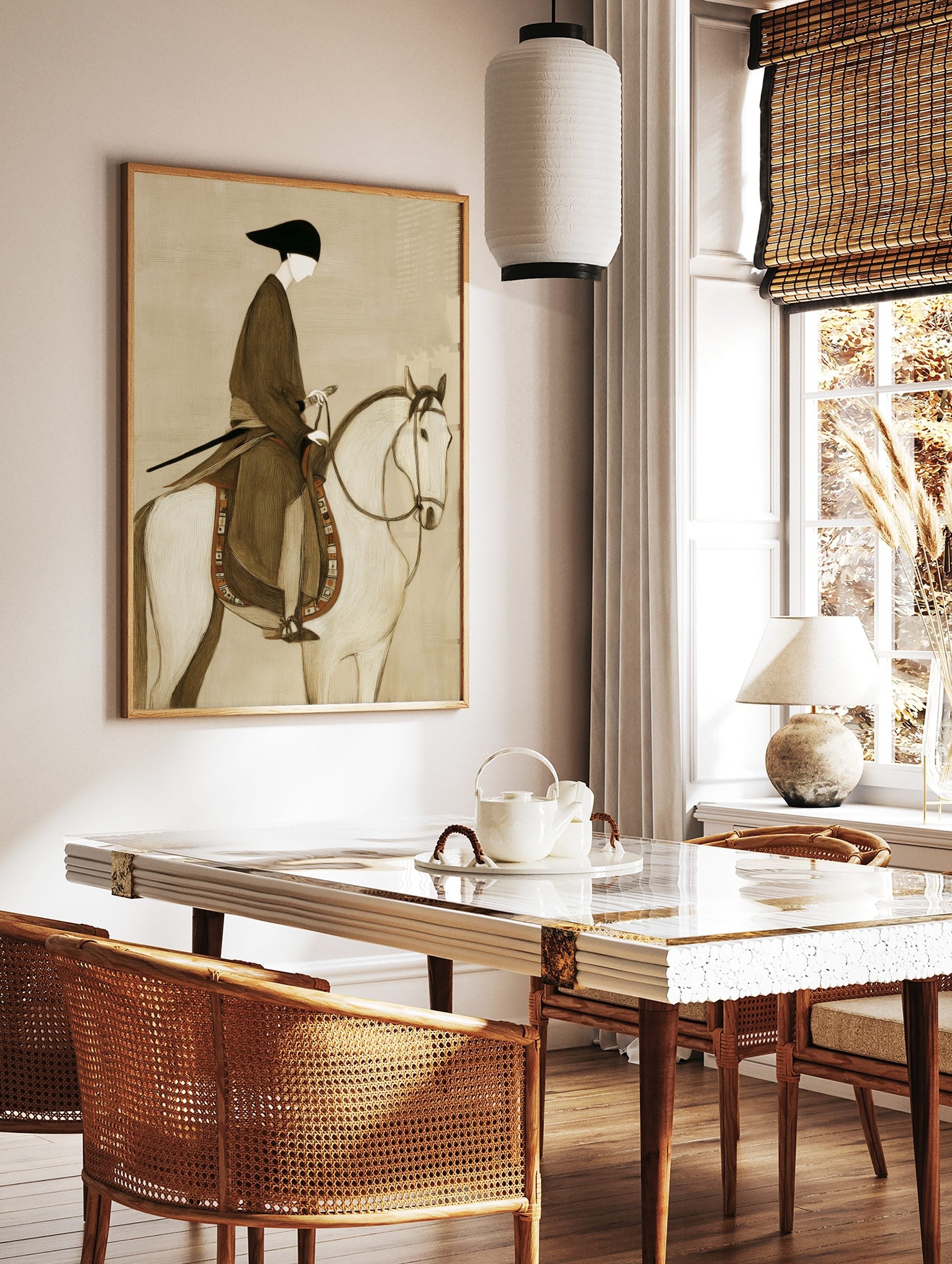 Illustrative print of a stylised figure in dark robe and black hat riding a white horse with, in a styled room mockup