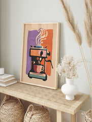 Illustrative espresso machine with coffee cup and steam, purple and orange background, in an alternate framed mockup