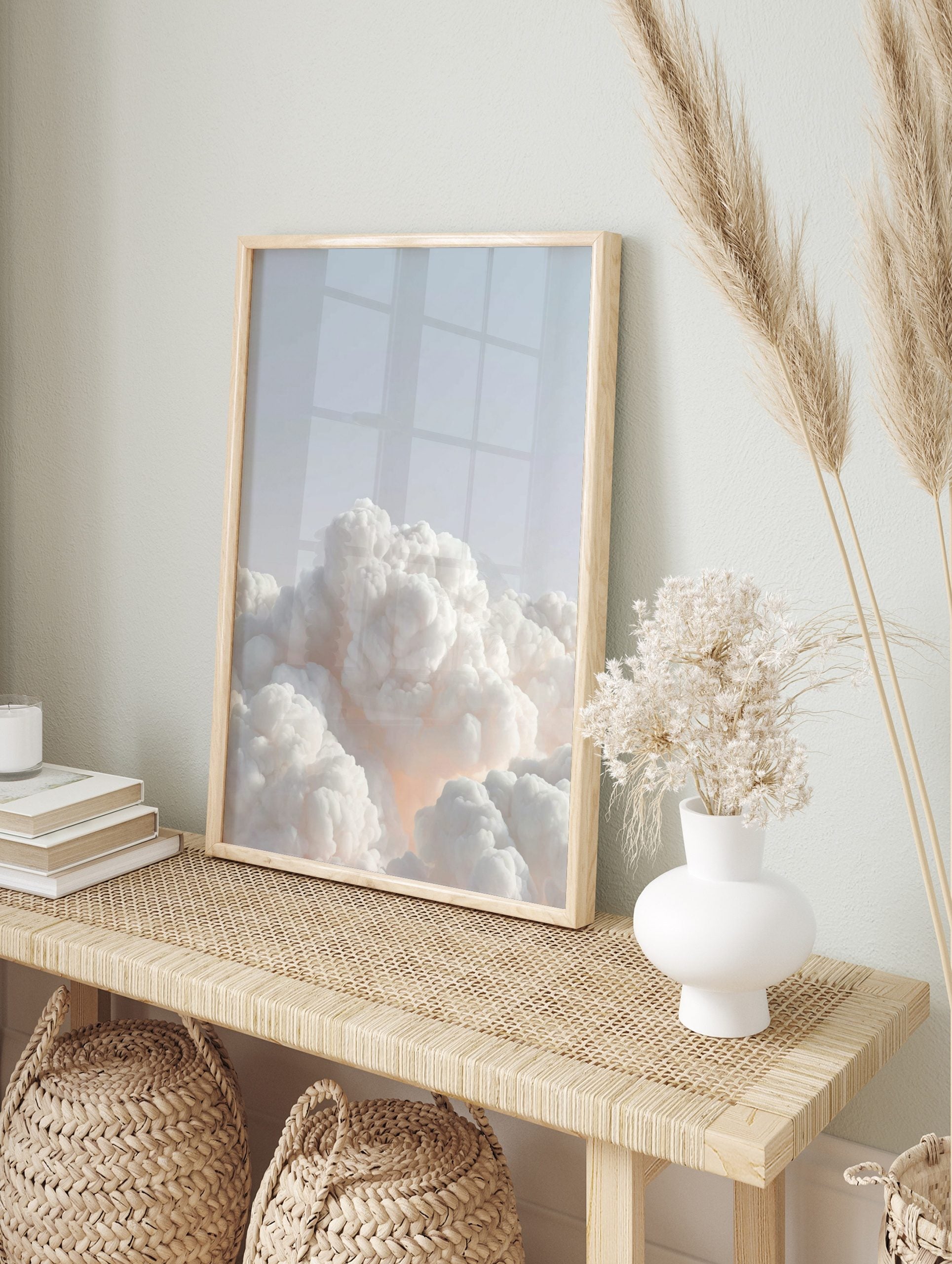 Ethereal white voluminous clouds against a pale blue sky with a soft warm glow, minimalist, in an alternate framed mockup
