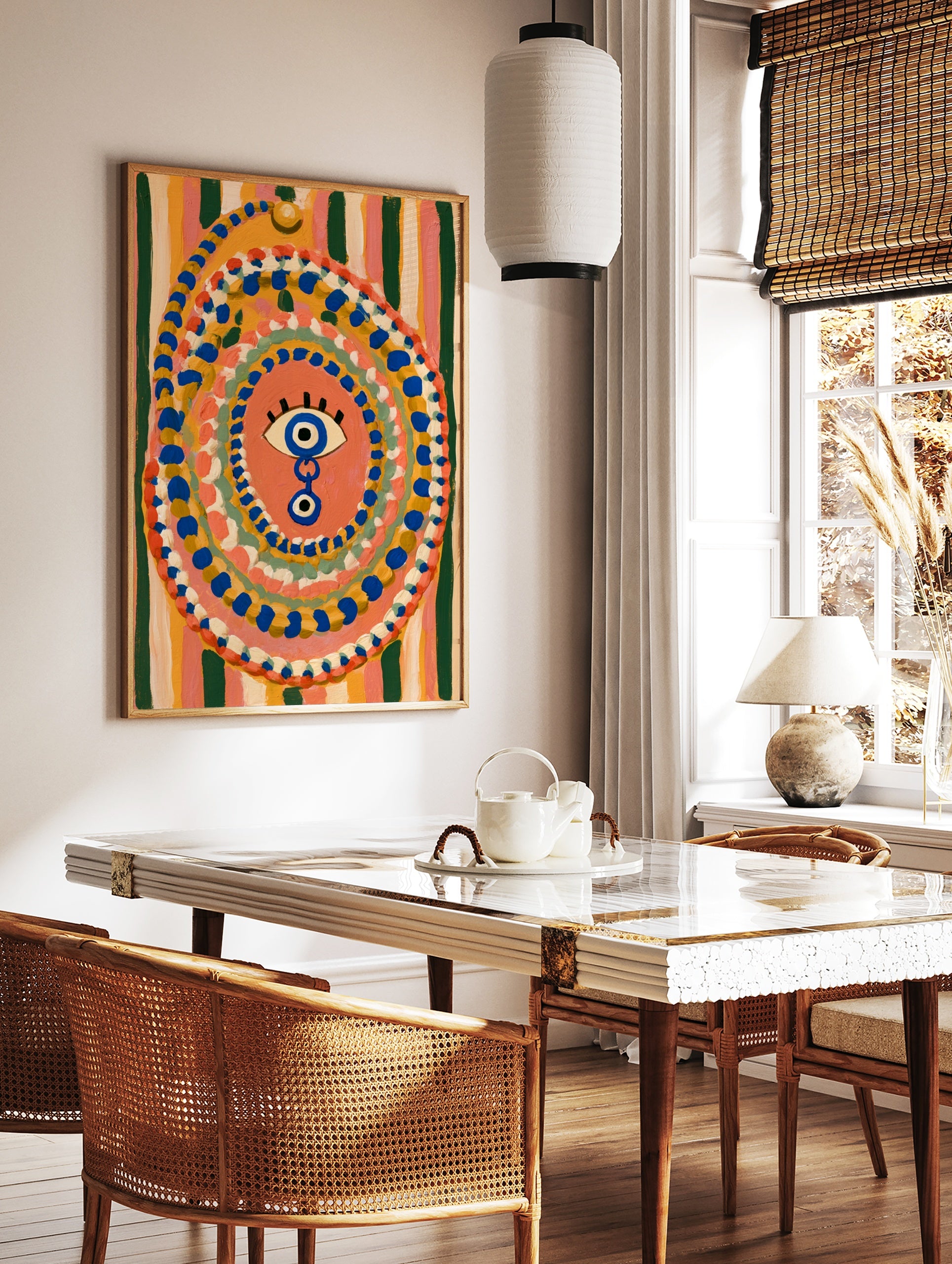 Evil eye wall art with blue and yellow concentric dots on a striped background, illustrative, in a styled room mockup