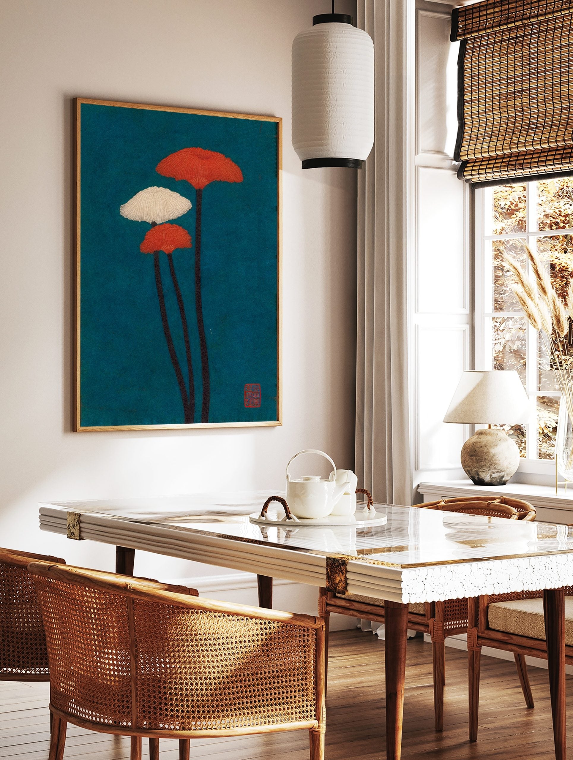 Illustrative wall art of three fanned mushroom plants with orange and white caps against a deep, in a styled room mockup