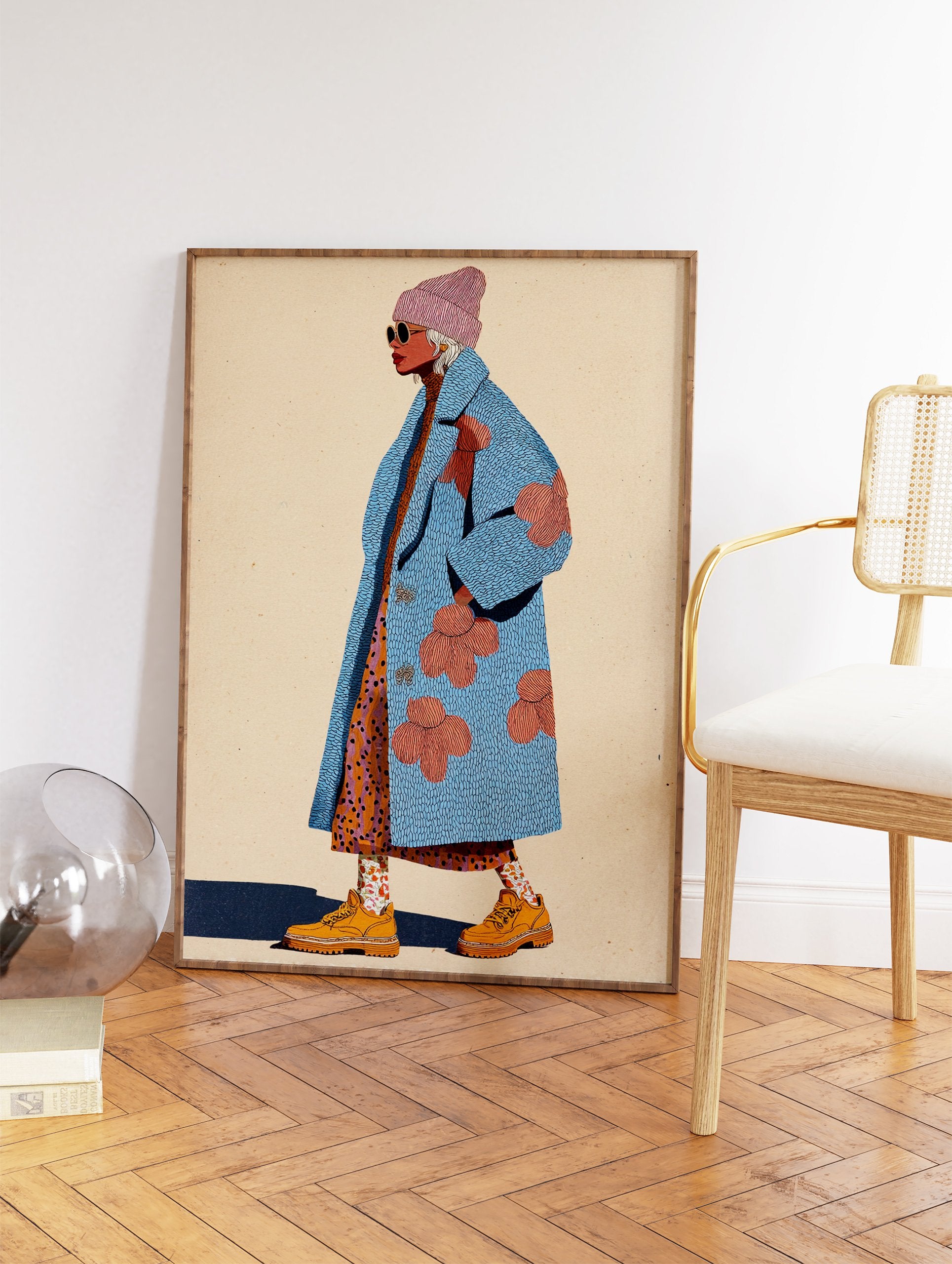 Fashion illustration of a stylish woman wearing a textured blue coat with pink flowers, a pink beanie, sunglasses, and orange boots. - Image 2