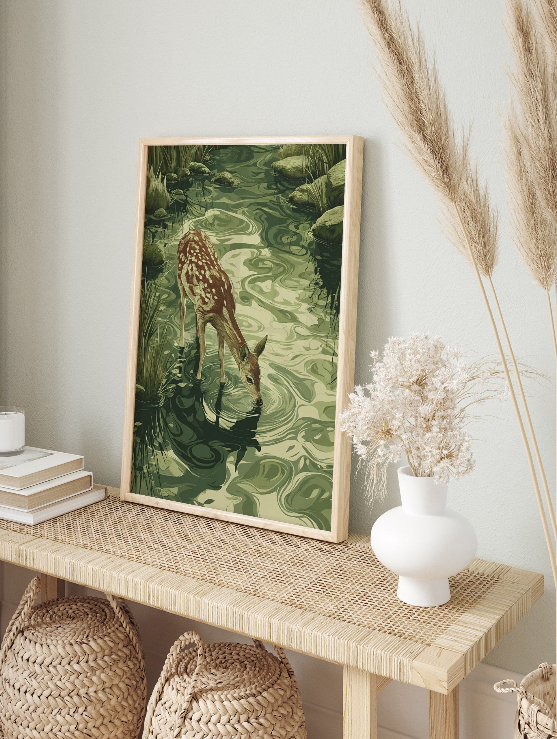 Fawn drinking poster, an illustration of a young deer at a green stream with ripples, surrounded by grass and rocks. - Image 4