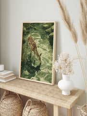 Fawn drinking poster, an illustration of a young deer at a green stream with ripples, surrounded by grass and rocks. - Image 4