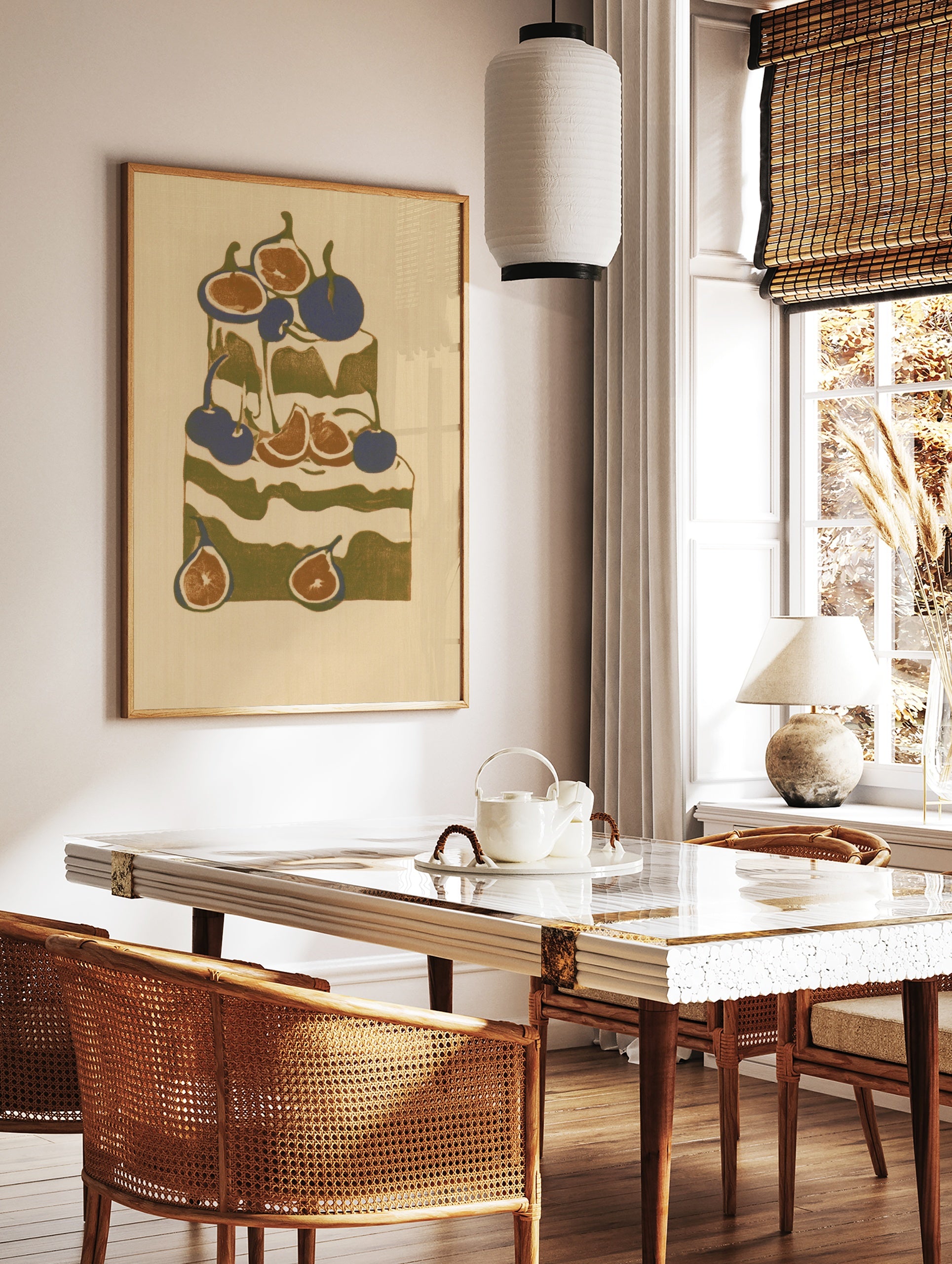 Stylized cake illustration with figs and cherries in olive green, deep blue, and cream, in a styled room mockup