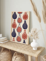 Botanical fig wall art print featuring a repeating pattern of whole and sliced figs in deep, in an alternate framed mockup