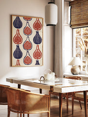 Botanical fig wall art print featuring a repeating pattern of whole and sliced figs in deep blue, in a styled room mockup