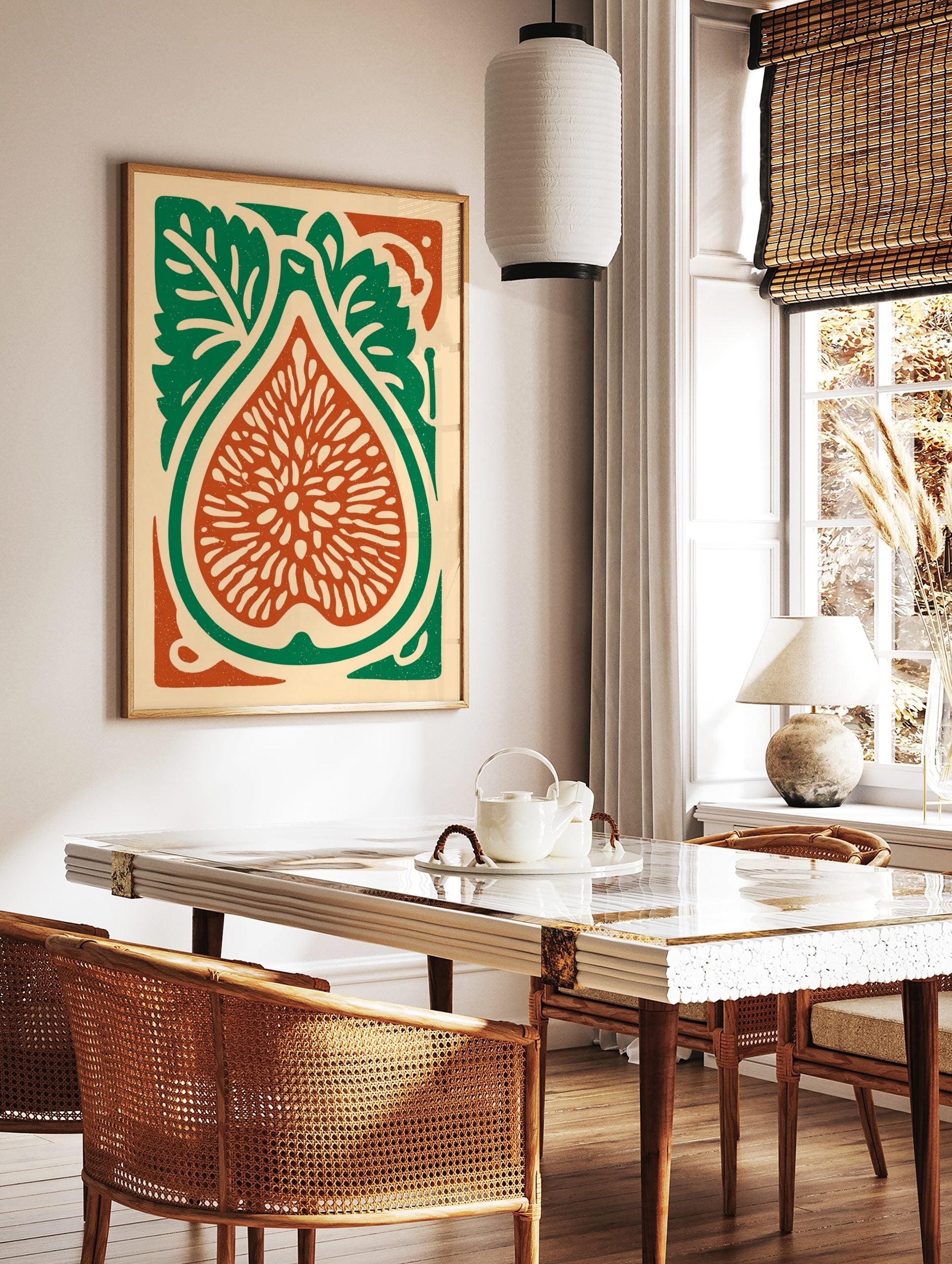 Illustrative fig botanical print, cut in half with seeds, green leaves, and reddish-orange flesh on, in a styled room mockup