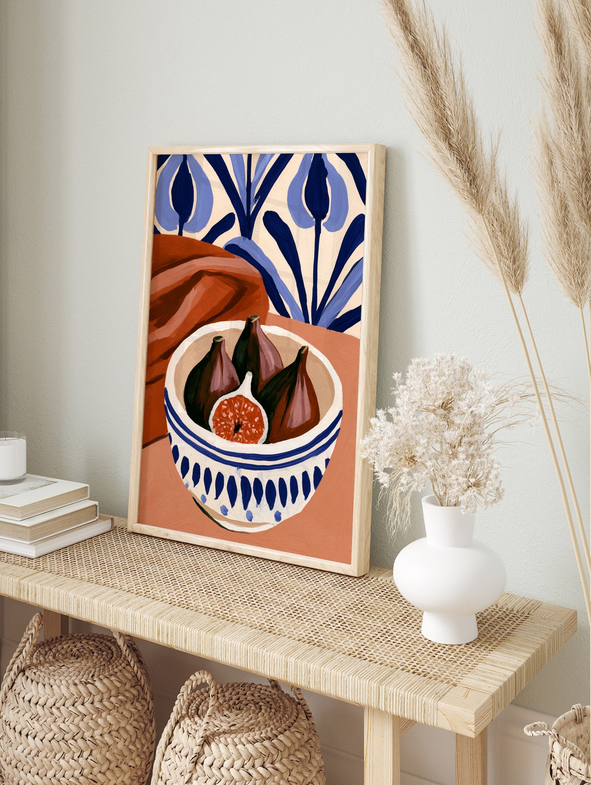 Still life art print of figs in a blue and white patterned bowl with terracotta fabric and, in an alternate framed mockup