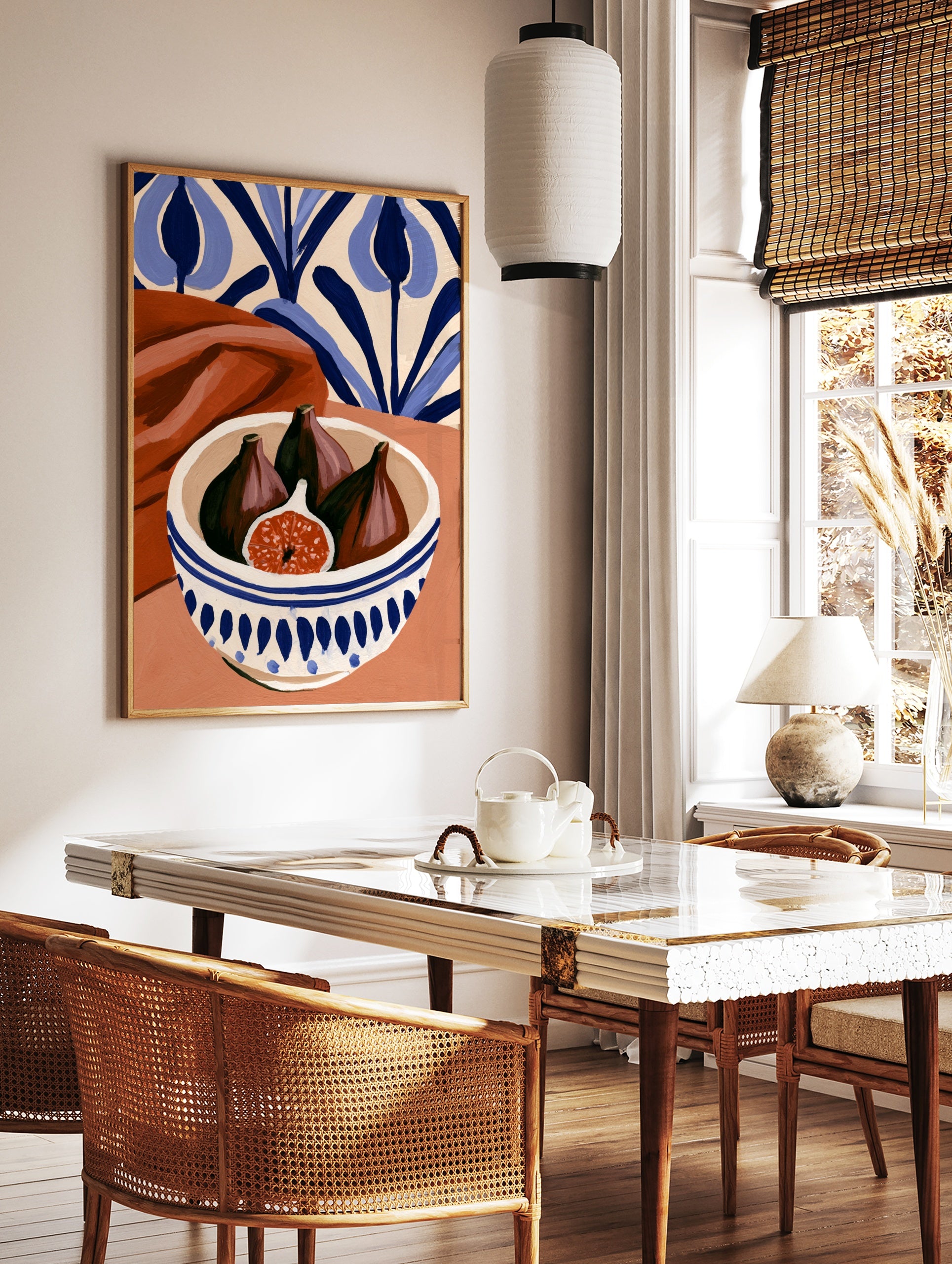 Still life art print of figs in a blue and white patterned bowl with terracotta fabric and blue, in a styled room mockup