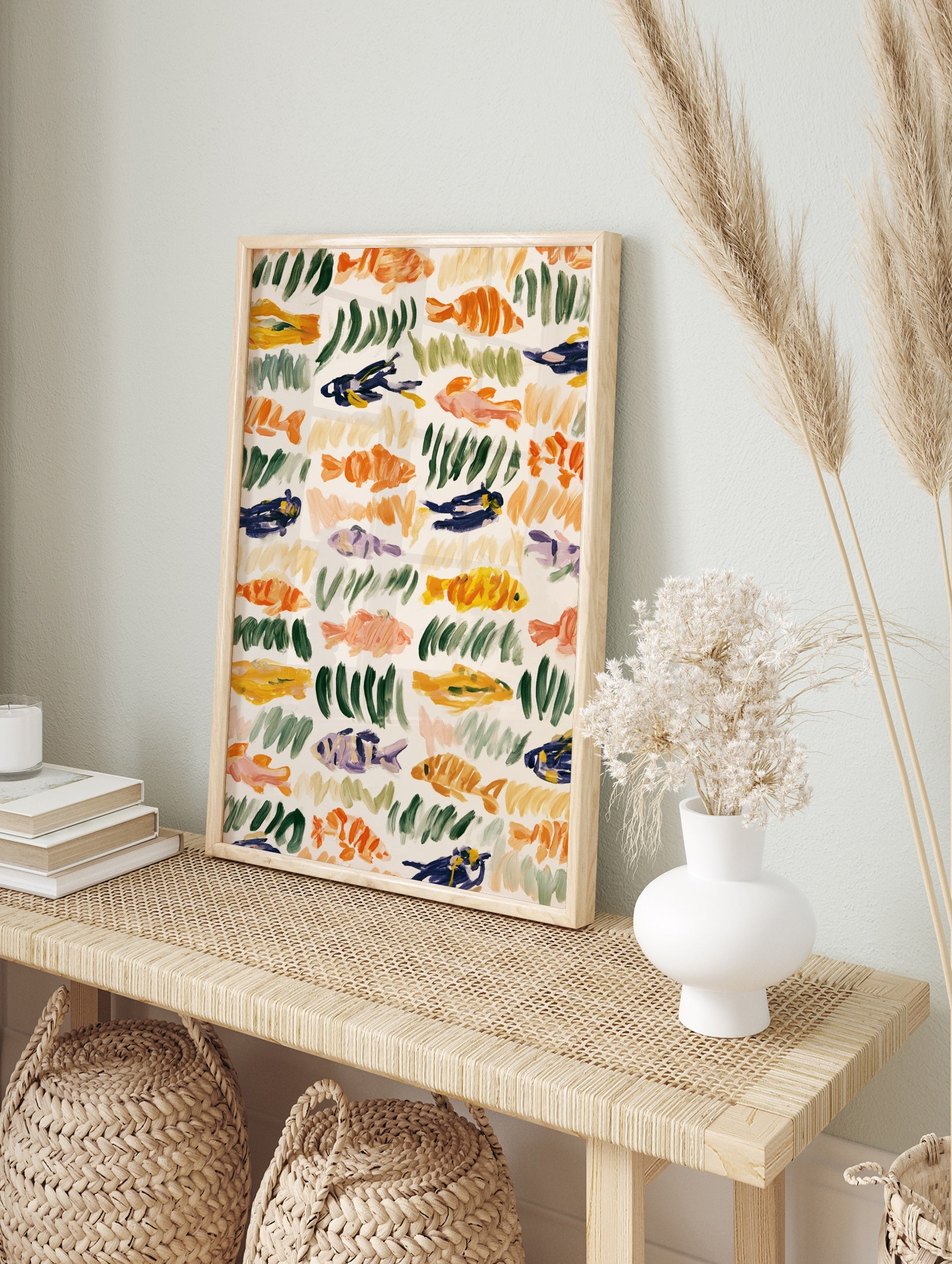 Abstract fish and seaweed illustration with orange, green, and blue brushstrokes on a cream, in an alternate framed mockup