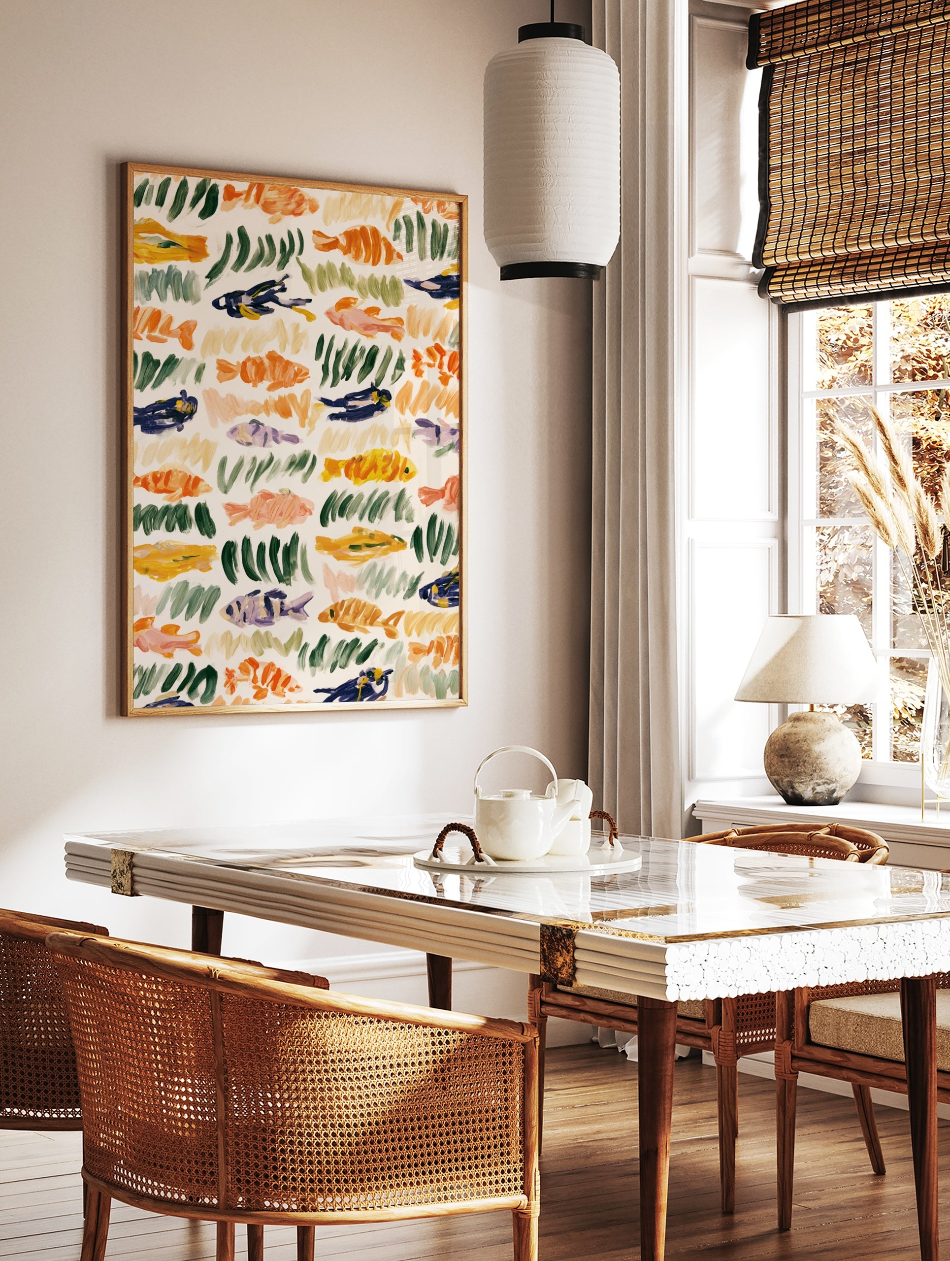 Abstract fish and seaweed illustration with orange, green, and blue brushstrokes on a cream, in a styled room mockup