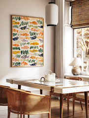 Abstract fish and seaweed illustration with orange, green, and blue brushstrokes on a cream, in a styled room mockup