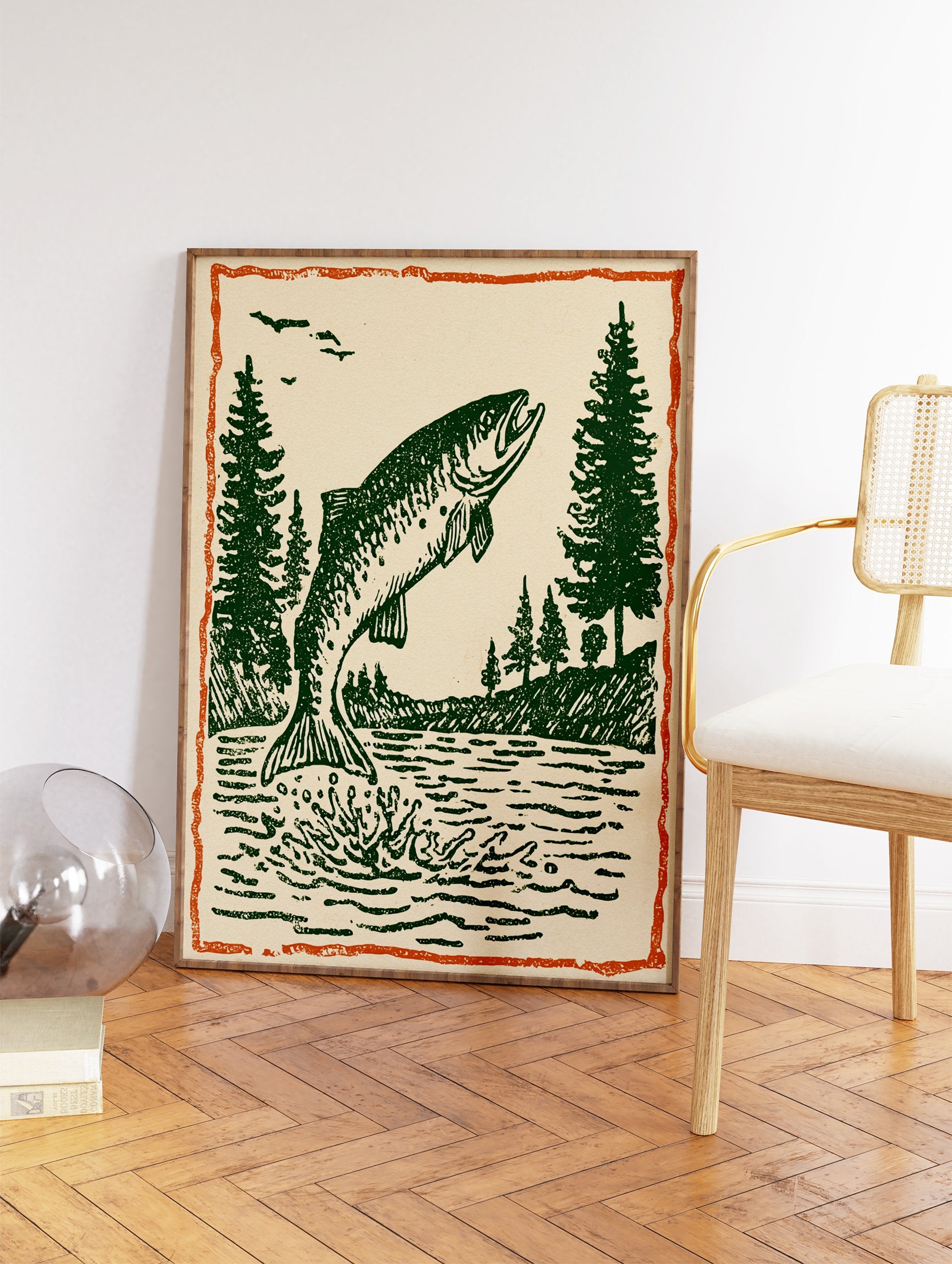 Vintage fish wall art print showing a green fish jumping out of water with pine trees and birds under an orange border. - Image 2