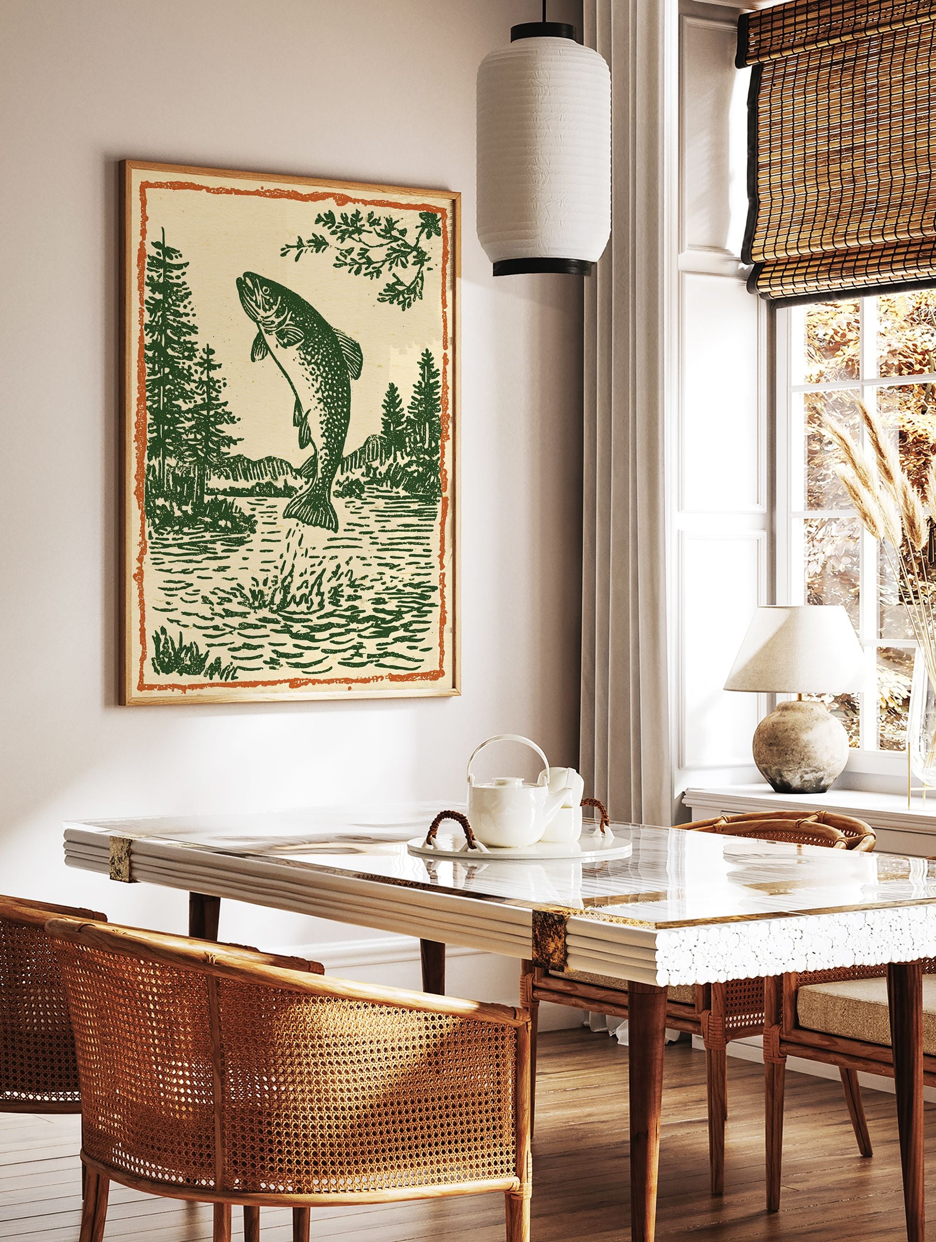 Woodcut style illustration of a jumping trout fish in a lake with pine trees and mountains, framed by an orange border. - Image 3