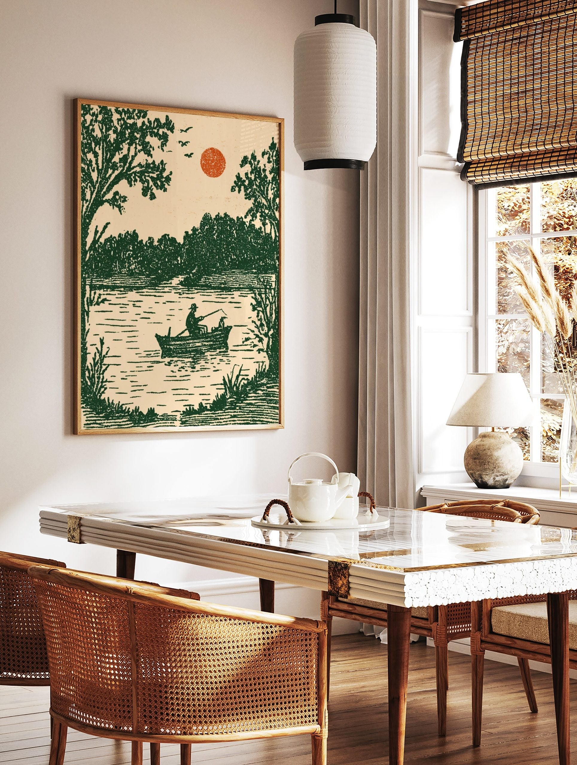 Vintage illustrative art print of a fisherman and dog in a boat on a lake with green trees and, in a styled room mockup