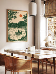 Vintage illustrative art print of a fisherman and dog in a boat on a lake with green trees and, in a styled room mockup