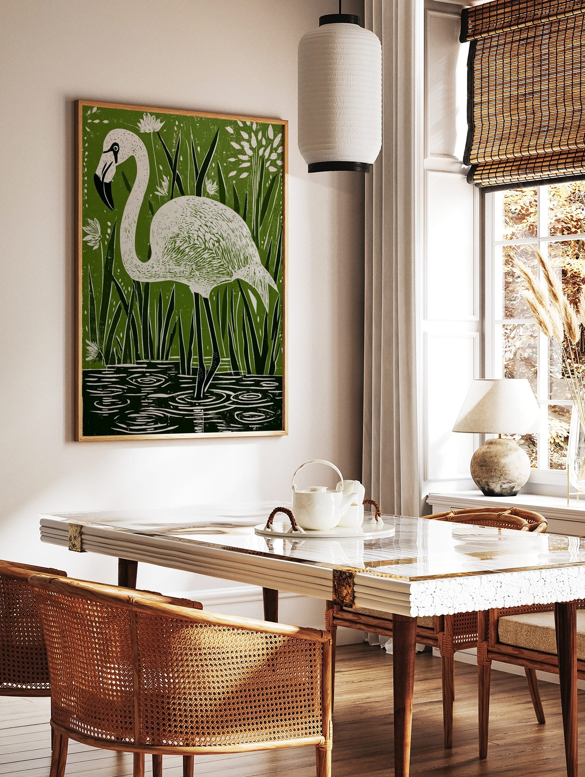 White flamingo in linocut style, standing in water among green reeds and white flowers, in a styled room mockup