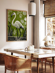 White flamingo in linocut style, wading in water with green background, white plants, and stylised, in a styled room mockup