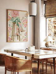 Illustrative print of a person's legs wearing colourful floral cowboy boots, sitting on a wooden, in a styled room mockup