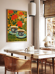 Floral tea cup poster with two dark blue patterned cups and saucers against an orange background with red flowers and green leaves. - Image 2